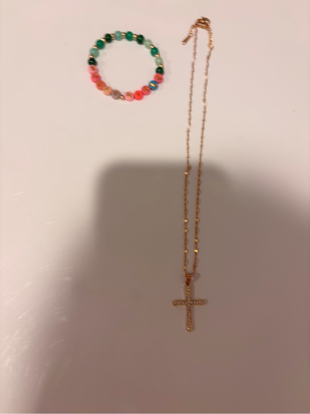 Gold Cross Pendant Necklace with Multicolor Bracelet that says Holly Bible